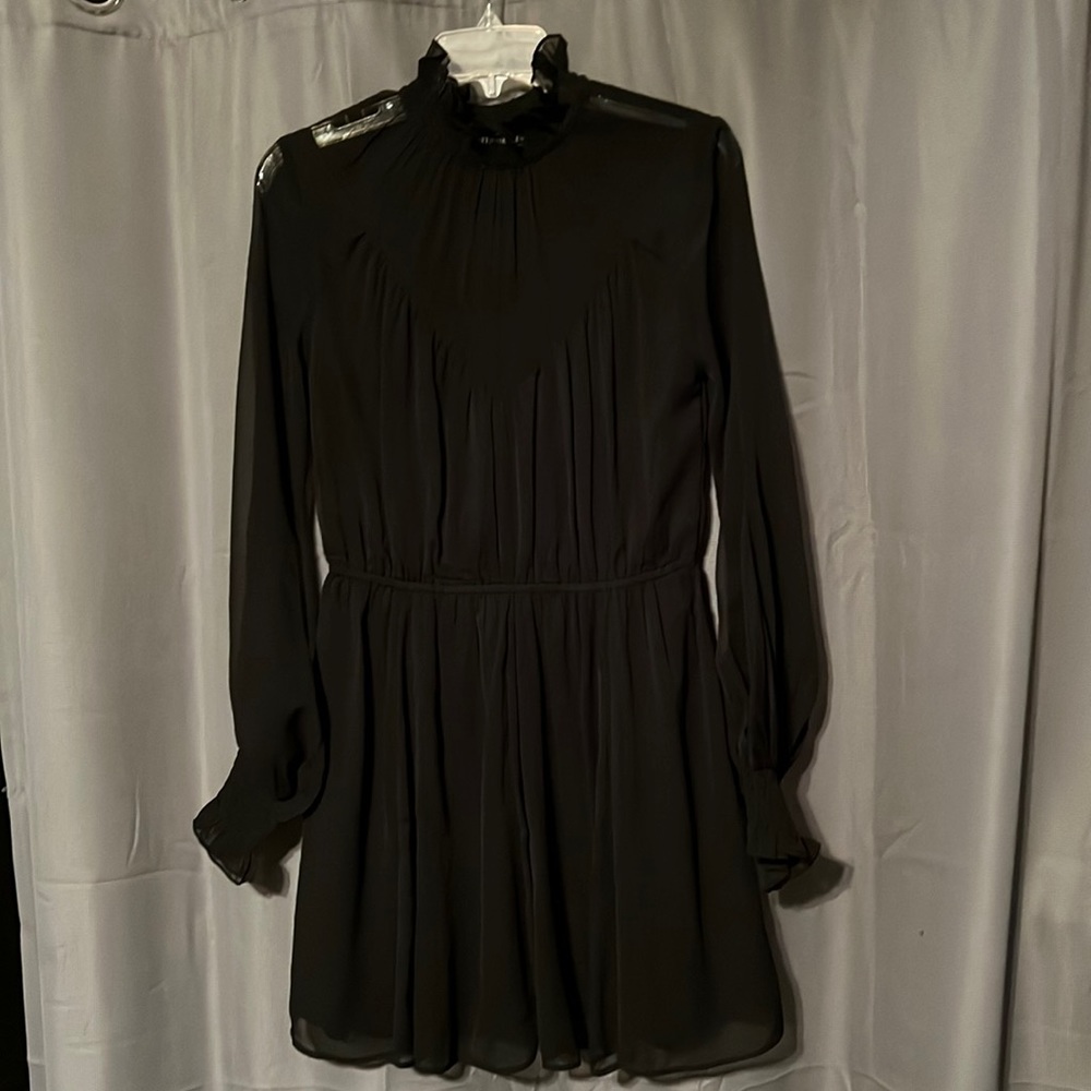 Tularosa brand little black dress. Size small. Black lined black sheer overlay.
